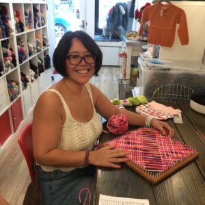 Nancy with Square Loom Weaving in Progress